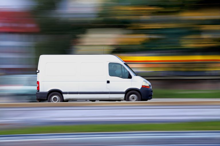 Blur white van panning and move